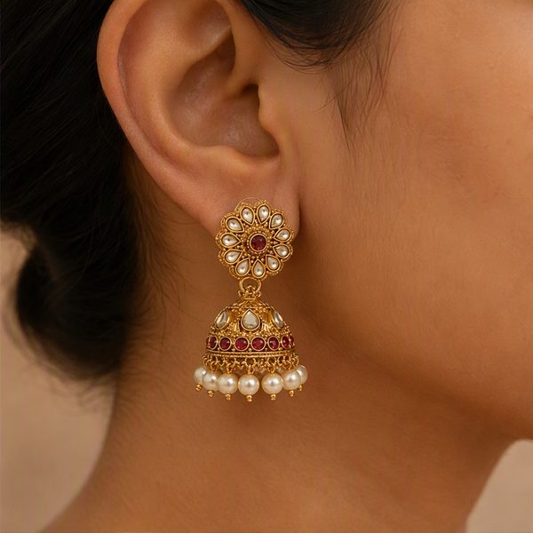 Earrings worn, close crop of ear and neck